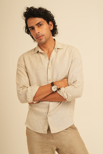 Man wearing a 100% European Linen shirt, the highest quality of pure linen in the world. Available at an accessible price point which is less than half that of traditional brands. The shirt is has a regular fit for everyday wearing. Works well in office, and out. Perfect for vacations due to the fabric's high breathability and light weight.